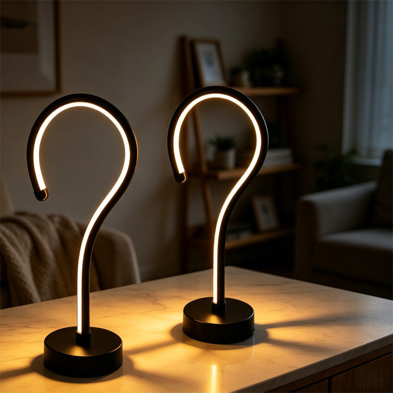 Two glowing question mark table lamps