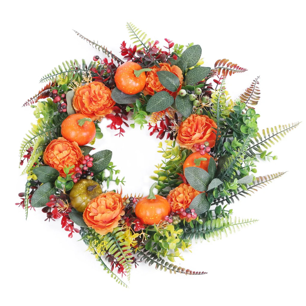 Autumn wreath with mini pumpkins and berries